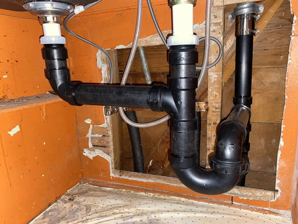 Professional Garbage Disposal Repair equipment and tools on the job in Highland Park